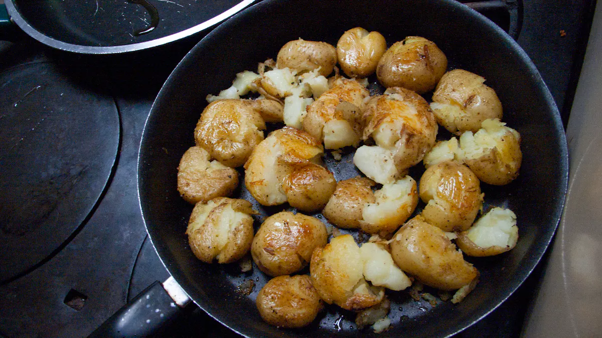 Crispy leftover roasted potato pieces reheating in a cast iron skillet on a stovetop, with browned edges and a wooden spoon nearby